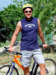 Jeffrey on a mountain bike, grinning